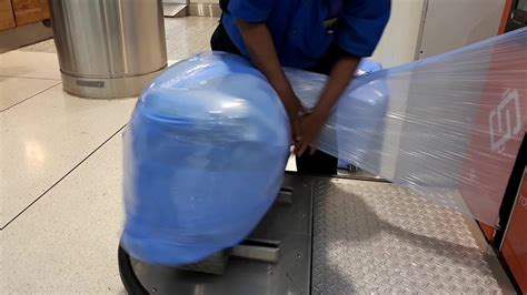 toronto pearson airport luggage wrapping.